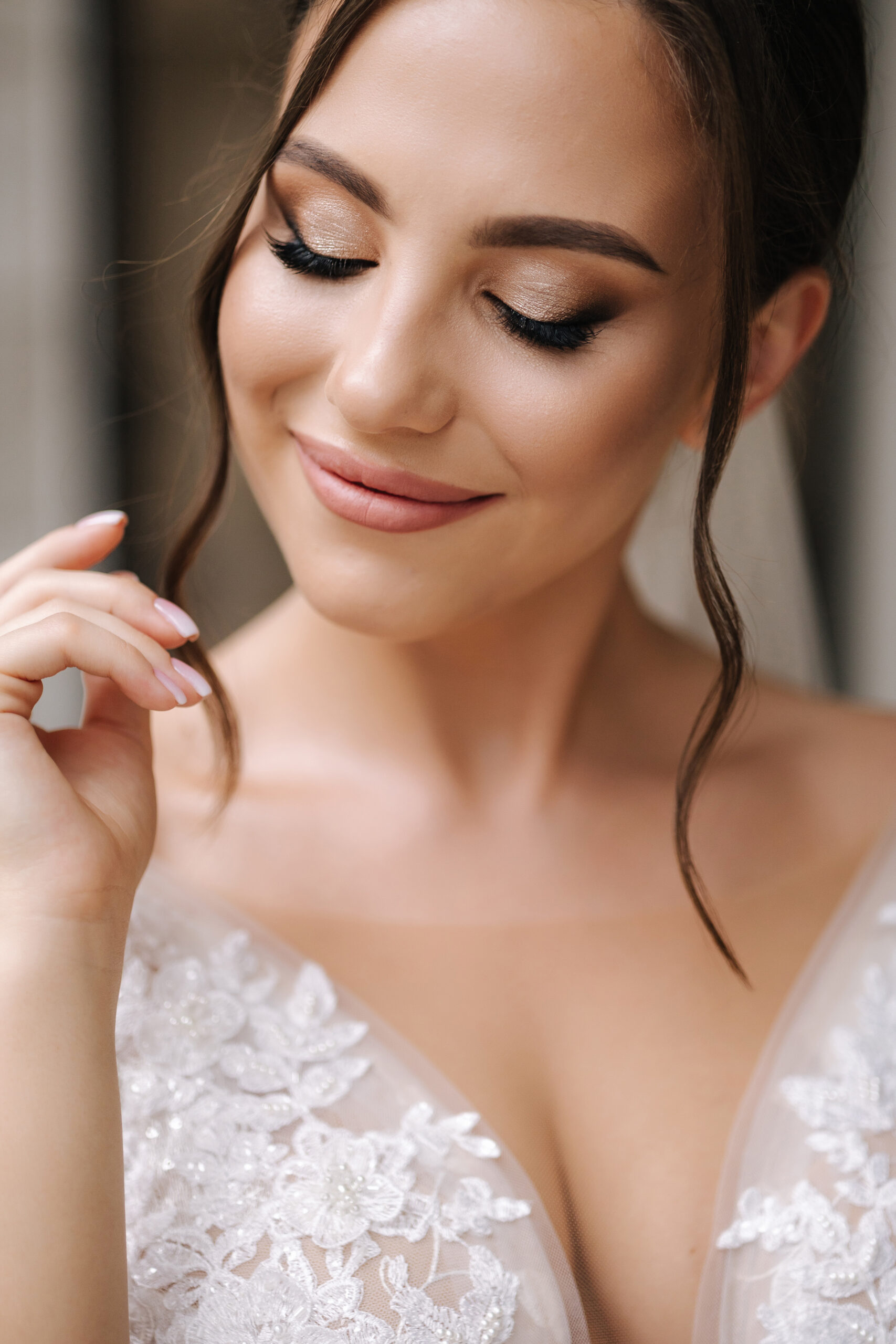 Close-up portrait of elegant woman in luxury wedding dress. Bride morning concept