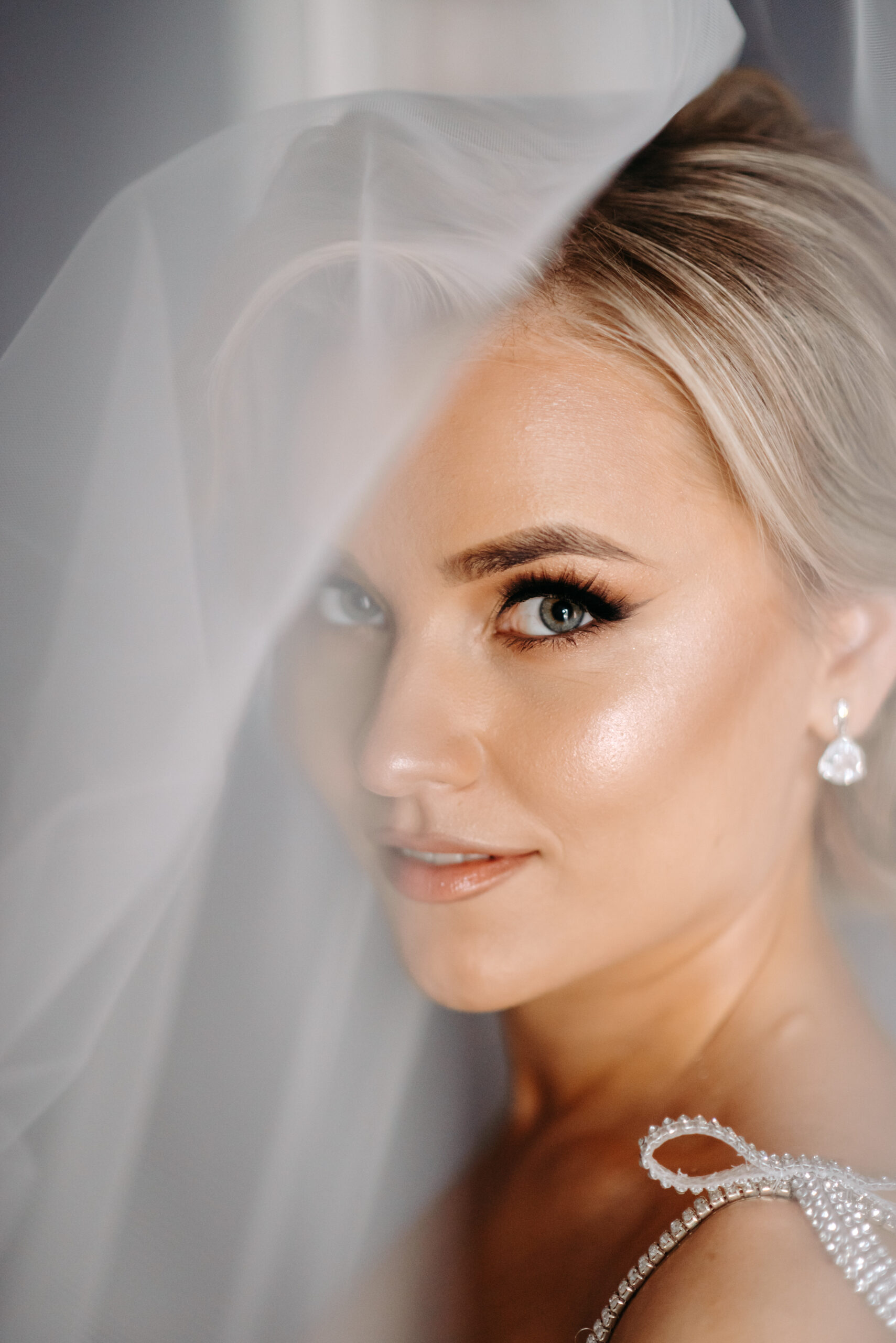 woman-wearing-wedding-dress-with-white-veil
